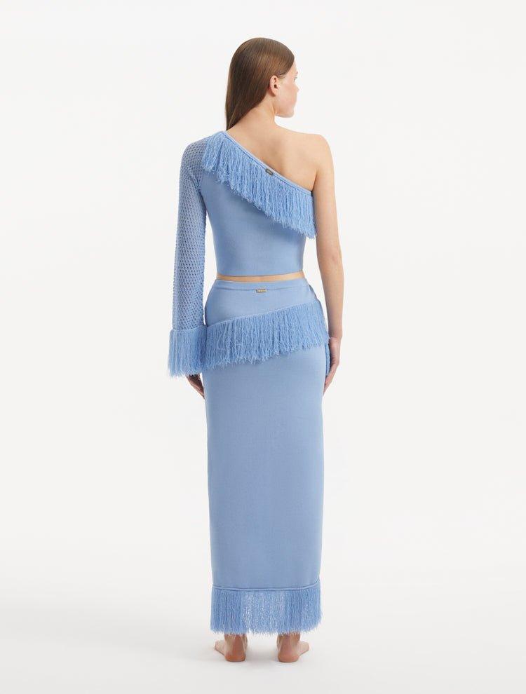 "Model wearing the Monroe Baby Blue Top and Alani Skirt from the back, showcasing the clean lines and cropped design. "