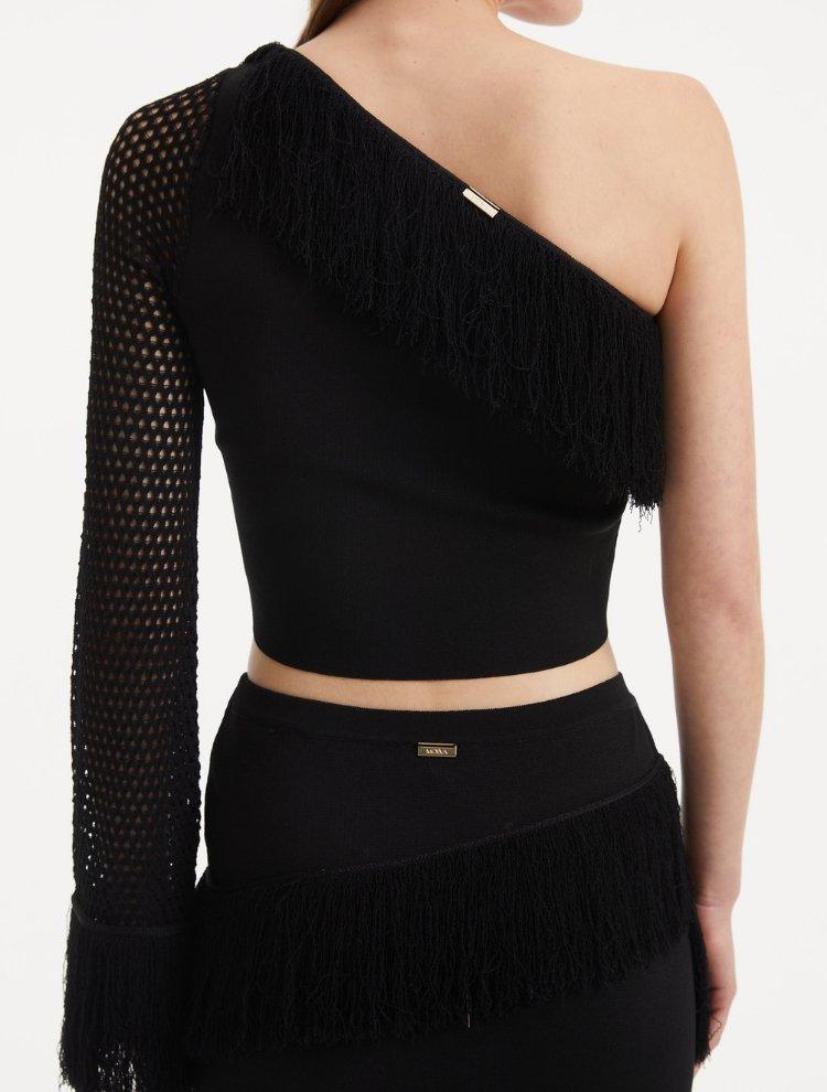 "Model wearing the Monroe Black Top from the back, highlighting the clean lines and cropped length. "