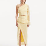 "Model showcasing the Monroe Yellow Top and Alani Skirt from the front, highlighting the one-shoulder design and the cheerful baby yellow hue. "