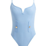 Artistic depiction of the Muriel Baby Blue Swimsuit, highlighting its graceful V-shape detail, elegant shell button accents, and luxurious Italian fabric in a beautifully stylized composition.