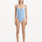 Model showcasing the Muriel Baby Blue Swimsuit with a V-shape detail, highlighting its tranquil hue and elegant design.