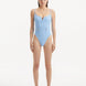 Model showcasing the Muriel Baby Blue Swimsuit with a V-shape detail, highlighting its tranquil hue and elegant design.