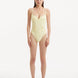 Model showcasing the Muriel Yellow Swimsuit with a vibrant V-shape detail, emphasizing its flattering and eye-catching design.