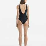 Back view of the Naida Black Swimsuit, highlighting the fit and moderate bottom coverage.