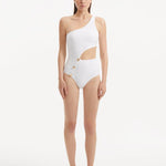 Model showcasing the Narella White Swimsuit, highlighting the elegant one-shoulder design and cutout detail.