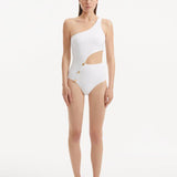 Model showcasing the Narella White Swimsuit, highlighting the elegant one-shoulder design and cutout detail.