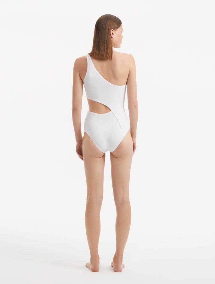 Back view of the Narella White Swimsuit, emphasizing its full bottom coverage and sleek fit.