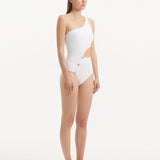 Side profile of the Narella White Swimsuit, illustrating the modern cutout and sophisticated one-shoulder silhouette.