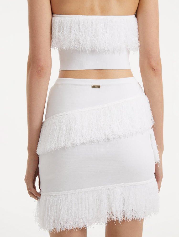 "Close-up view of the Nebula White Knit Top, capturing the intricate knit texture, bright white color, and playful fringed hemline."