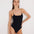 Front View: Model in Ninetta Black Swimsuit - MOEVA Luxury Swimwear, Scoop Neck, Slimming Effect Stitch Detail, Adjustable Geometric Chain Straps, Removable Padding, Italian Fabric, MOEVA Luxury Swimwear 