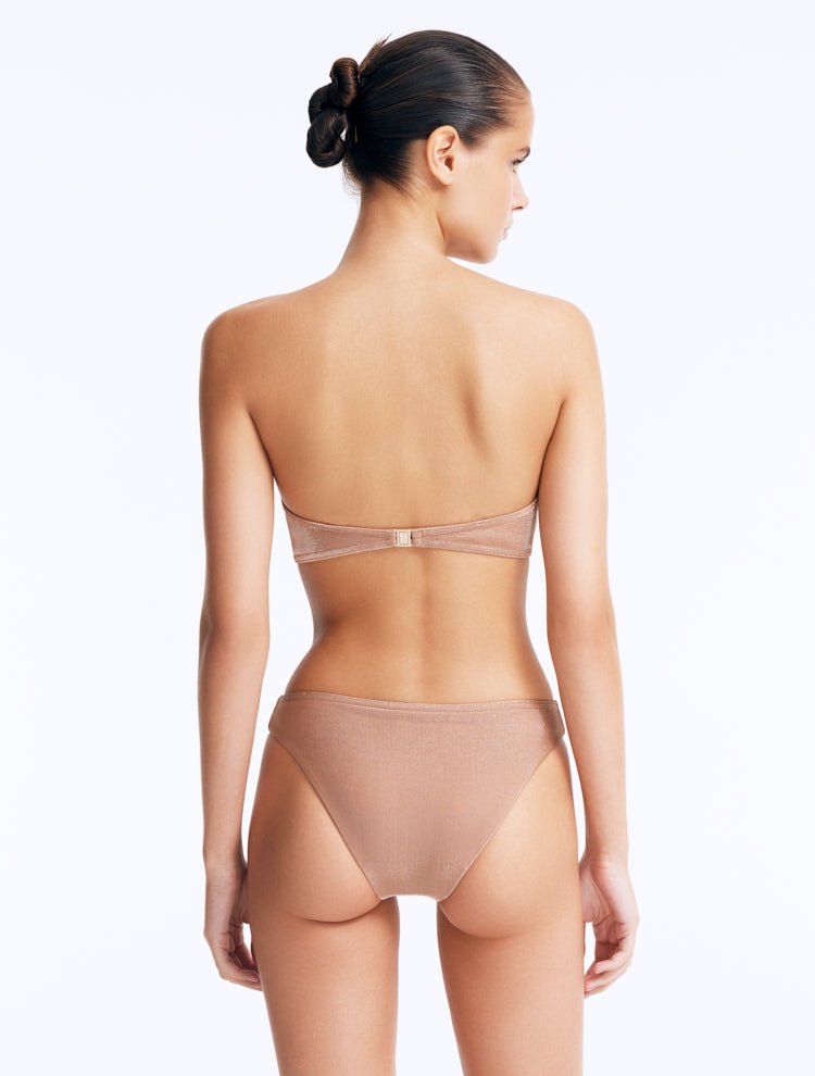 Back View: Model Wearing Nixie Bronze Bikini Bottom - Mid Rise, Hipster Style, Fully Lined, Italian Fabric, Movable Accessories, MOEVA Luxury Swimwear
