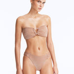 Front View: Model in Nixie Bronze Bikini Set- Classic Briefs, Chic Style, Metallic Fabric, Clear Glass Drop Shaped Accessories, MOEVA Luxury Swimwear