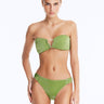 Front View: Model Showcasing Nixie Green Bikini Set - Bandeau Style, Chic and Accessorized, Metallic Fabric, Clear Glass Drop Shaped Accessory, MOEVA Luxury Swimwear