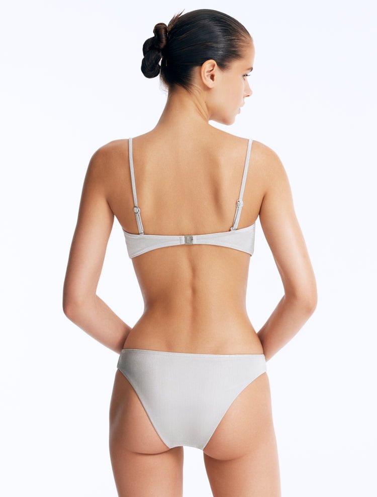 Back View: Model Wearing Nixie Silver Bikini Bottom - Mid Rise, Hipster Style, Fully Lined, Italian Fabric, Movable Accessories, MOEVA Luxury Swimwear