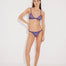 "Front view of North Lilac Bikini Top – Featuring a glittery metallic finish and adjustable straps for a glamorous beach look."