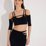 Front View: Model in Ontario Black Skirt - MOEVA Luxury Swimwear, Knitted, High Rise, Thigh Length, MOEVA Luxury Swimwear