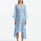 "Model wearing the Opal Baby Blue Kaftan from the front, highlighting the V neckline, knee-length cut, and self-tie belt."