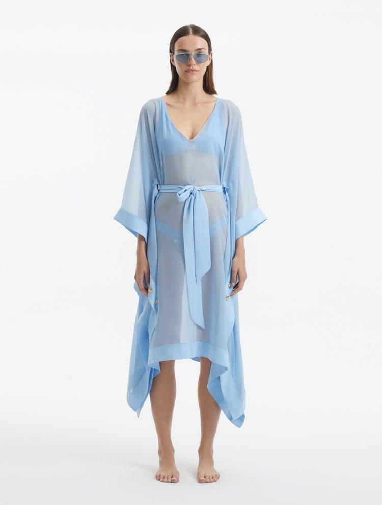 "Model wearing the Opal Baby Blue Kaftan from the front, highlighting the V neckline, knee-length cut, and self-tie belt."