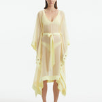 "Model wearing the Opal Yellow Kaftan from the front, highlighting the V neckline, knee-length cut, and self-tie belt."