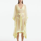 "Model wearing the Opal Yellow Kaftan from the front, highlighting the V neckline, knee-length cut, and self-tie belt."