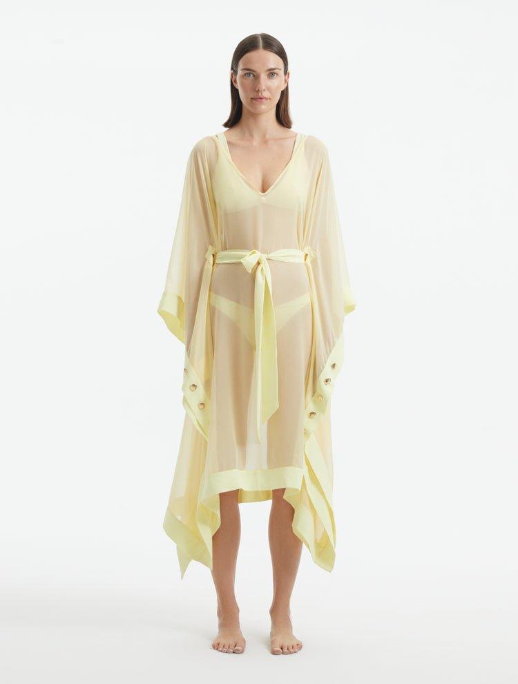 "Model wearing the Opal Yellow Kaftan from the front, highlighting the V neckline, knee-length cut, and self-tie belt."