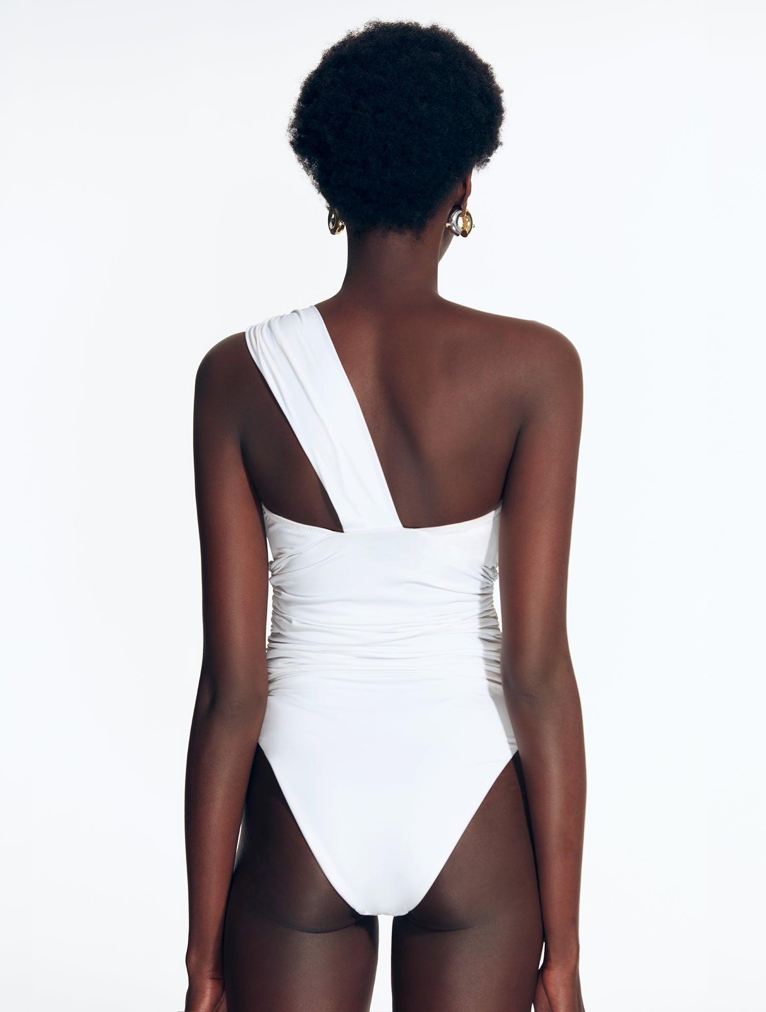 "Back view of Penny White Swimsuit, emphasizing the high-leg cut and luxurious fabric"