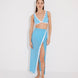 "Model wearing the Pina Blue/White Asymmetrical Beach Skirt with gold buttons, showcasing a side slit and elegant fit."
