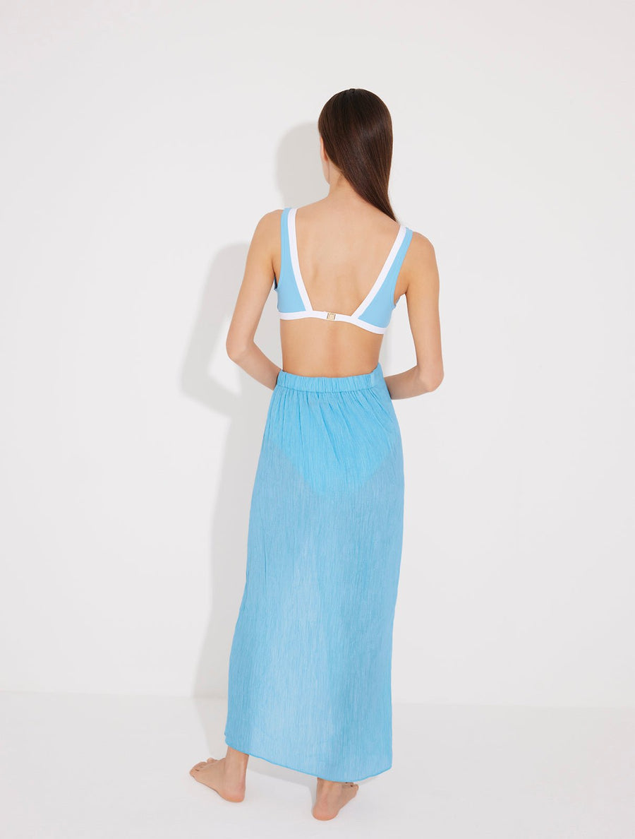 Back View: Model in Pina Blue/White Skirt - MOEVA Luxury Swimwear, Duo Colored, Textured Fabric, Beachwear, Soft Touch Fabric, Unlined MOEVA Luxury Swimwear