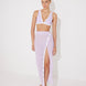 "Model wearing Pina Lilac/White Skirt from the front, highlighting its chic asymmetrical design and side slit."