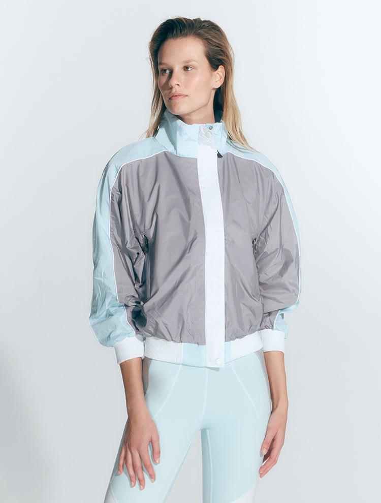 Pixie Green/Grey/White Jacket | Moeva | Activewear | Each week unveils new pieces—luxury swimwear, fluid resort silhouettes, and elevated summer-to-evening essentials designed to carry you from coastal escapes to city nights.