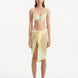 "Model wearing the Raiden Yellow Pareo from the front, featuring the playful wavy detailing and adjustable front tie."