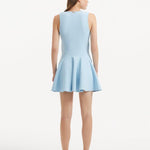 "Model displaying the Rayan Baby Blue Dress from the back, focusing on the smooth knit texture and thigh-length cut. "