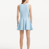 "Model displaying the Rayan Baby Blue Dress from the back, focusing on the smooth knit texture and thigh-length cut. "