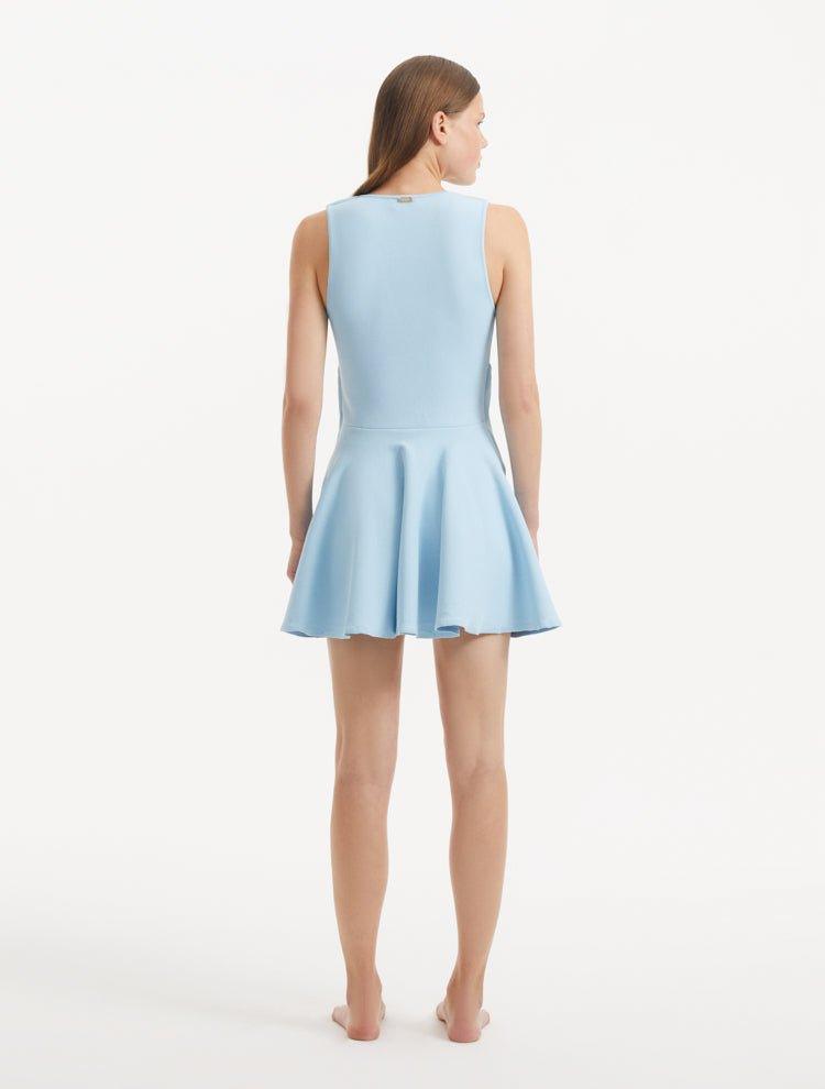 "Model displaying the Rayan Baby Blue Dress from the back, focusing on the smooth knit texture and thigh-length cut. "