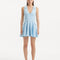 "Model wearing the Rayan Baby Blue Dress from the front, highlighting the finely knitted fabric, serene baby blue color, and shell-shaped gold buttons. "