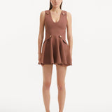 "Model wearing the Rayan Brown Dress from the front, showcasing the premium knitted fabric, the rich brown hue, and the shell-shaped gold buttons."