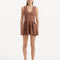 "Model wearing the Rayan Brown Dress from the front, showcasing the premium knitted fabric, the rich brown hue, and the shell-shaped gold buttons."