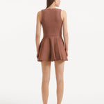 "Model displaying the Rayan Brown Dress from the back, focusing on the smooth knit texture and the thigh-length cut. "