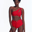 Front view of a model showcasing the Regina Red Bikini Bottom with a twist front and keyhole detail."