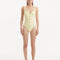 Introducing the Reva yellow swimsuit, a statement piece from our SS24 collection that is designed to imbue your beach style with a sense of joyous sunshine and radiant luxury.   Luxurious Feel Reva yellow swimsuit, in a vibrant yellow shade, embodies the very essence of summer, mirroring the dazzling sun and the radiant glow it casts over the world. This one-piece swimsuit features a flattering scoop neckline coupled with an underwire top, a delicate balance between elegant style and comfortable functionali