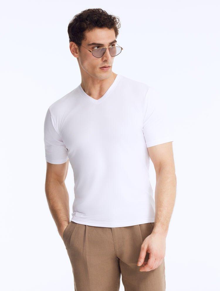 Front View of Model Wearing Rex White T-Shirt- MOEVA Luxury Swimwear, Ready to Wear, V-Neck T-Shirt Unlined Slim Fit T-Shirt - MOEVA Luxury Swimwear