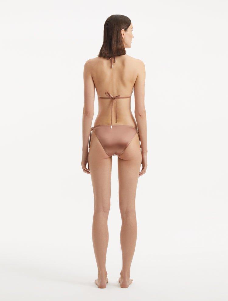 Back view illustrating the fit and elegant silhouette of the bikini bottom.