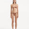Rhea Brown Bikini Bottom showcasing its stylish side-tie feature and overall design.