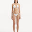 Rhea White Bikini Bottom showcasing the chic side-tie design and crisp white color.