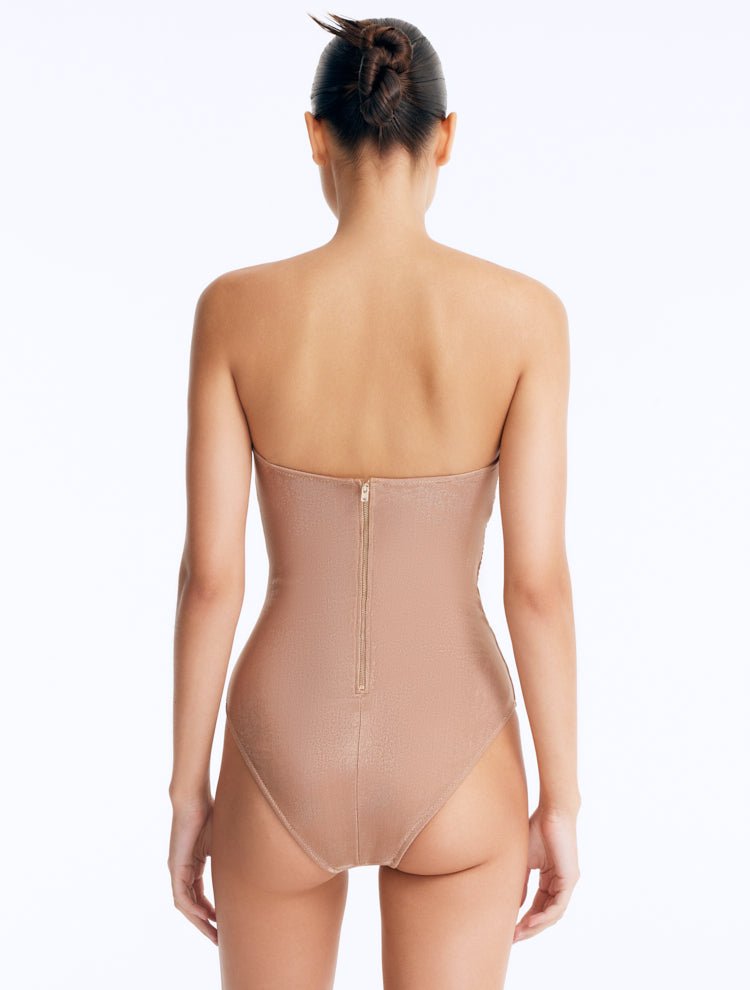Back View: Model Wearing Rhodes Bronze Strapless Swimsuit - Moderate Bottom Coverage, Zip Back Fastening, Italian Fabric, MOEVA Luxury Swimwear