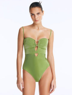 Front View: Model Wearing Rhodes Green Swimsuit - Chic Style, Fully Lined, Metallic Fabric, Clear Glass Accessory, MOEVA Luxury Swimwear