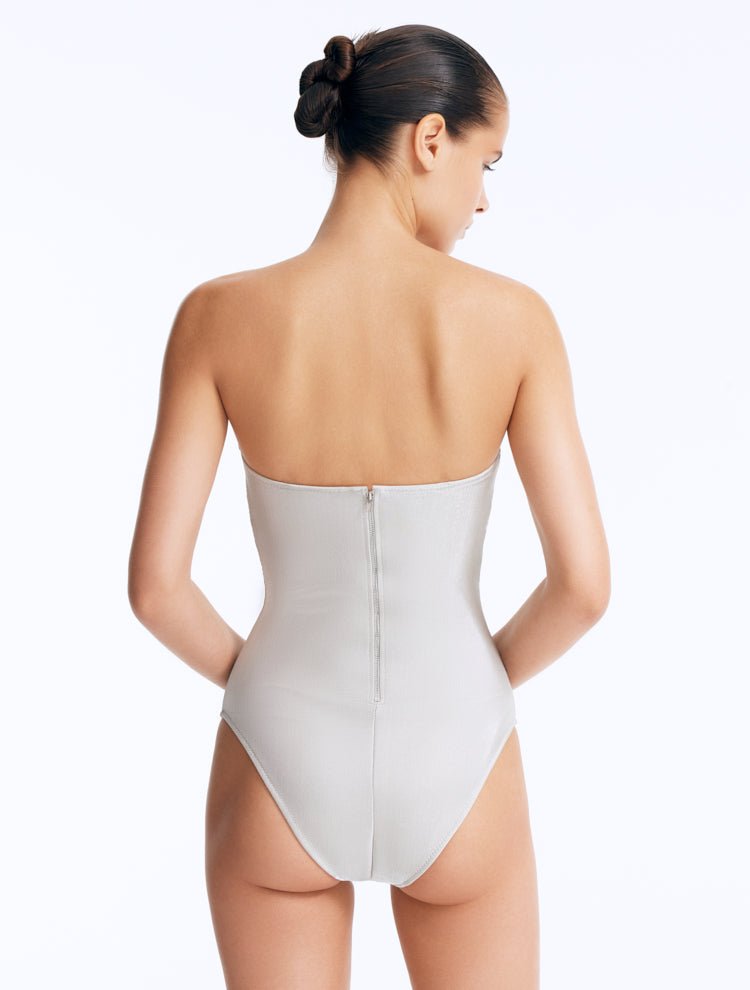 Back View: Rhodes Silver Swimsuit on Model - Moderate Bottom Coverage, Zip Back Fastening, Italian Fabric, MOEVA Luxury Swimwear