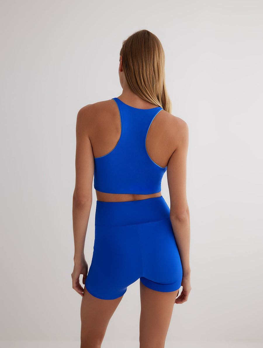 Back View: Model in Rocco Blue/Baby Blue Reversible Shorts - MOEVA Luxury Swimwear, Close Fit, 72% Polyamide 28% Elastane, MOEVA Luxury Swimwear