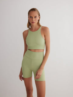 Front View: Model in Rocco Green/Nude Reversible Shorts - MOEVA Luxury Swimwear, 2 in 1 Reversible Short, Suitable for Swimming, Elasticated Waistband, MOEVA Luxury Swimwear