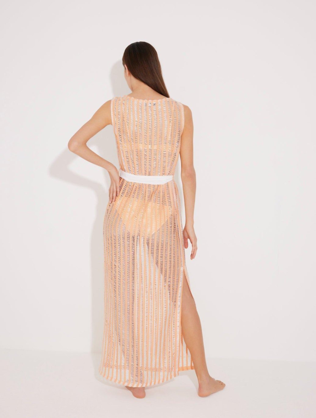 "Back view of the Roma Orange/White High-Neck Dress, highlighting its elegant high neck design, loose fit, and knee-high side slit. "